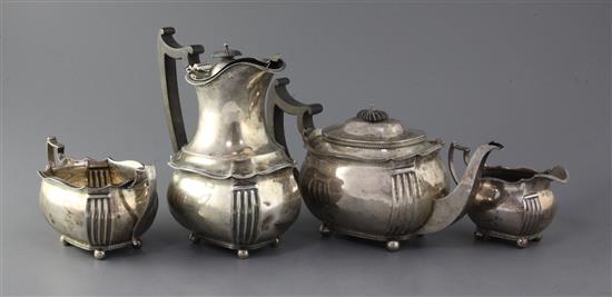 An Edwardian silver four piece tea set by Edward Barnard & Sons, gross 52 oz.